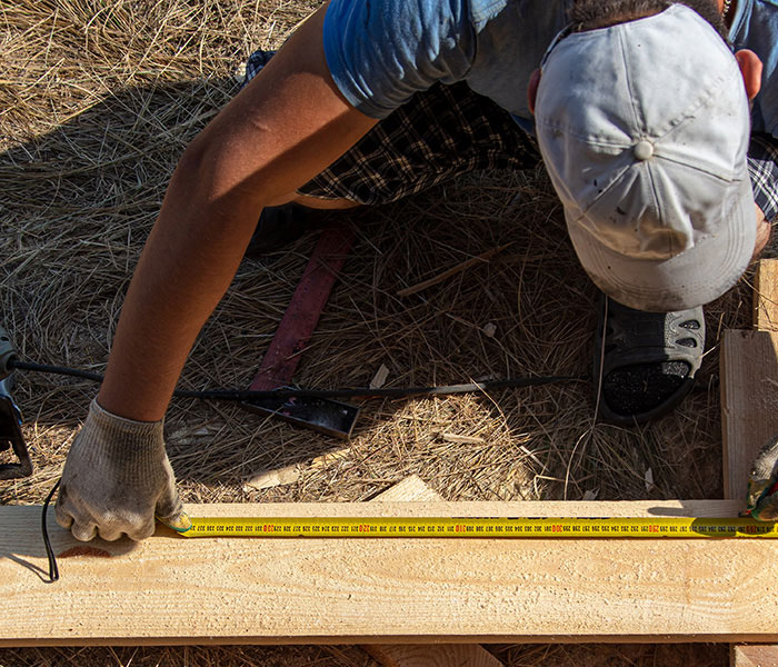 construction worker measuring